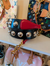 Gucci Maxi Stud Shoulder Strap in black leather with hibiscus red backing and gold-tone hardware