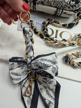 AUTHENTIC DIOR GWP, BLACK TOILE TOILETRY POUCH WITH 2 NON BRAND STRAPS & BOW CLIP ON CHARM, AUTHENTICITY CARD & BOX